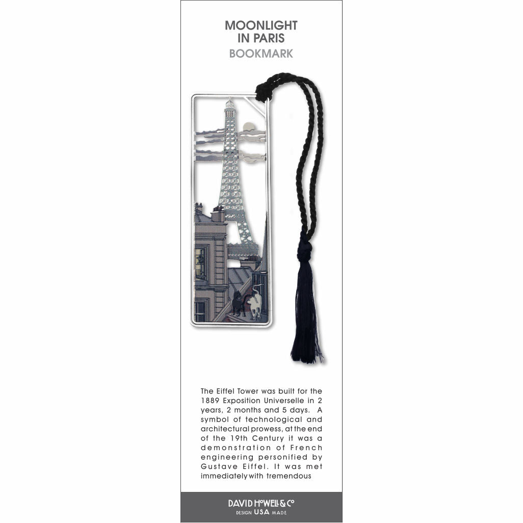 Moonlight in Paris’ bookmark featuring the Eiffel Tower at night with city scene, with a black braided tassel.