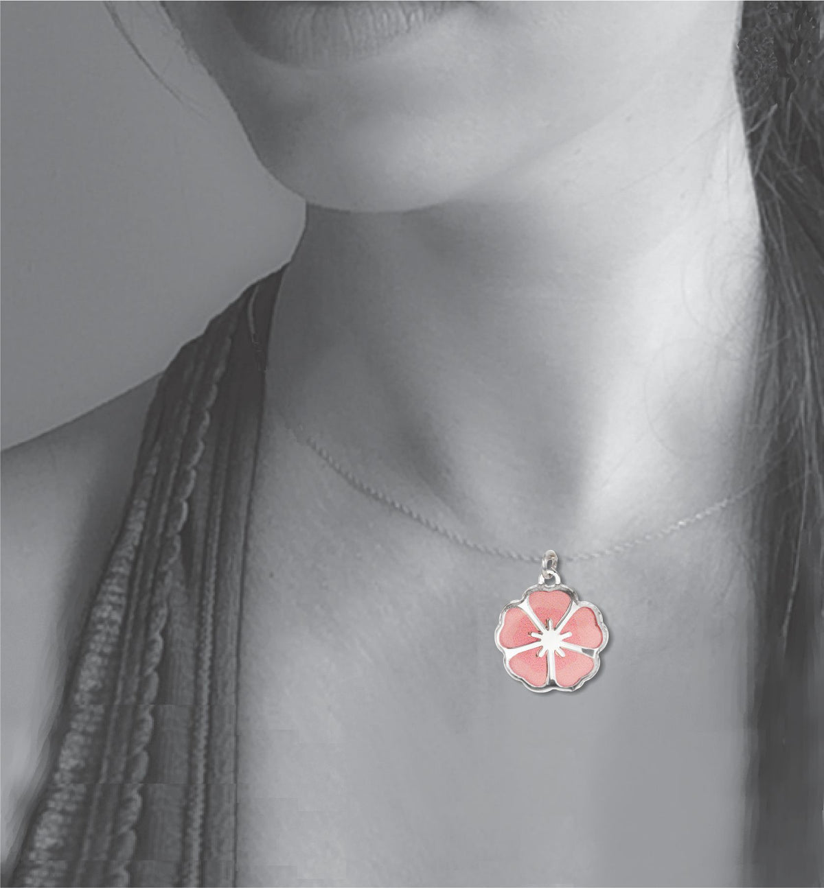 Model wearing the Single Blossom necklace, featuring a delicate silver-tone pendant with a soft pink sakura-inspired cherry blossom design.