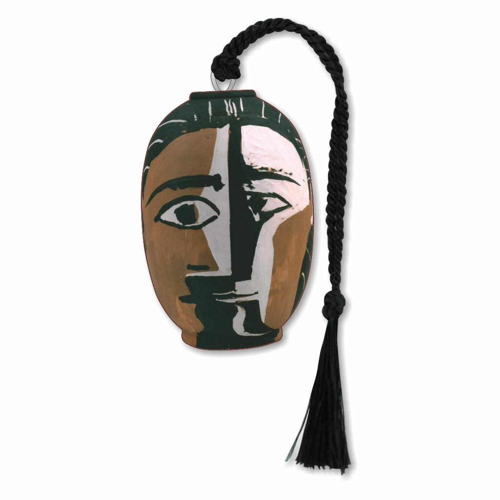 A silver metal bookmark featuring a Picasso geometric abstract design of a face in brown, white, and black, with a black tassel.