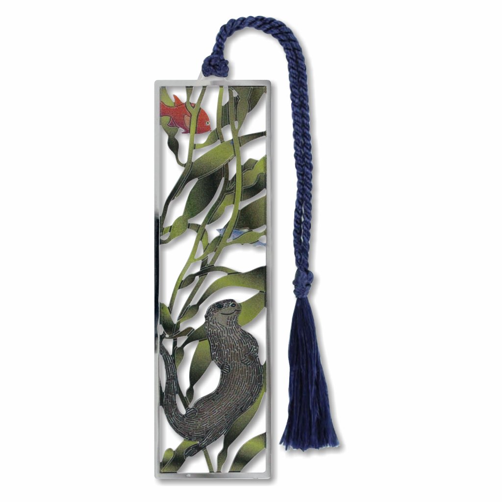 A silver metal bookmark with a design featuring a sea otter, a fish, and kelp forest attached to a blue tassel.