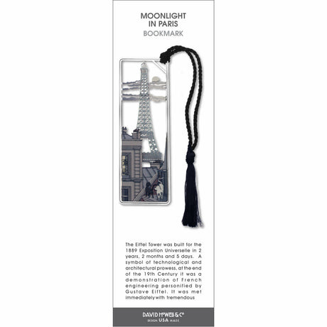 Moonlight in Paris’ bookmark featuring the Eiffel Tower at night with city scene, with a black braided tassel.