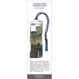Central Park Viewing South’ metal bookmark featuring Gapstow Bridge, NYC skyline at dusk, and a blue tassel.