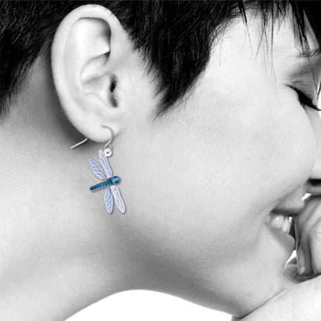 Dragonfly earrings: blue and lavender dragonfly drop earring worn on ear.