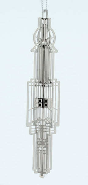 Decorative silver metal Frank Lloyd Wright Chauncey Williams Keepsake with a complex geometric design. 