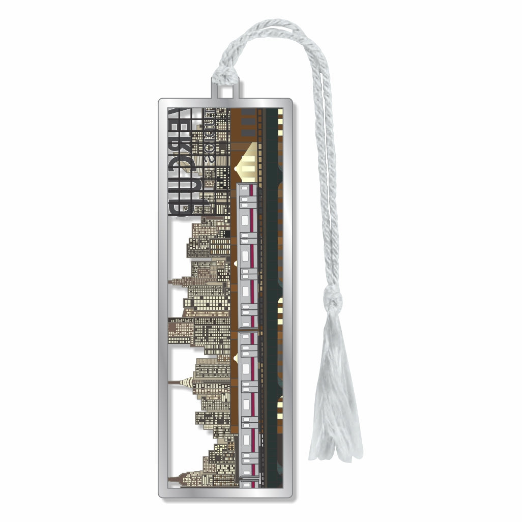 A metal bookmark featuring a detailed architecture of the Manhattan skyline and train, with silver braided tassel for  museum-quality gift for art lovers, train enthusiasts, museum goers and readers.