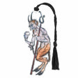 A metal bookmark featuring an illustration of a devil with a trident, attached to a black tassel and cardstock.