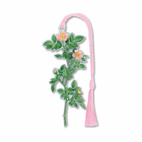 A metal bookmark with a pink tassel featuring an illustration of a rose plant with green leaves and yellow centers, inspired by Pierre-Joseph Redouté's Roses with pink braided tassel.